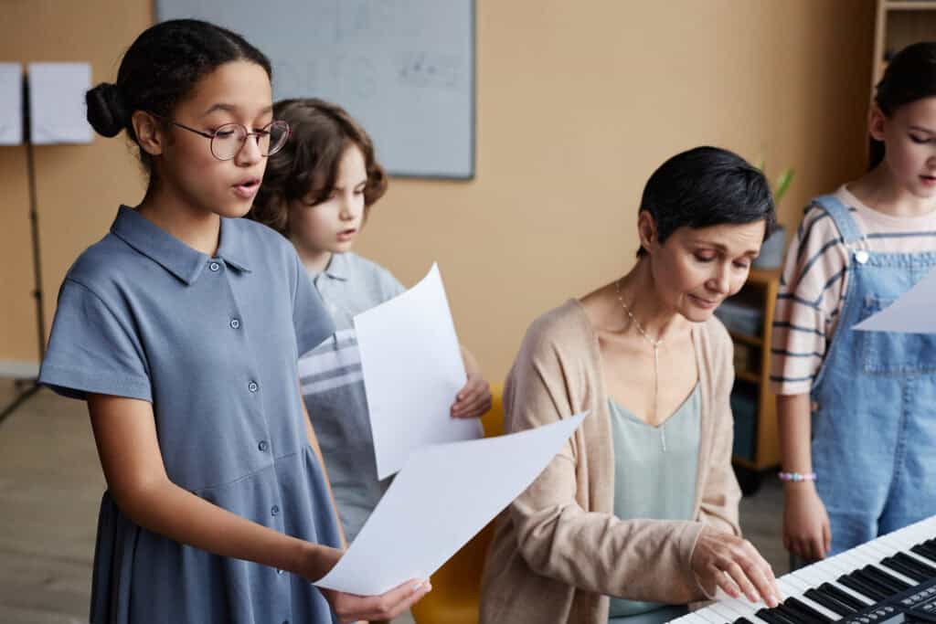 Choir Of Children Singing Songs In Class